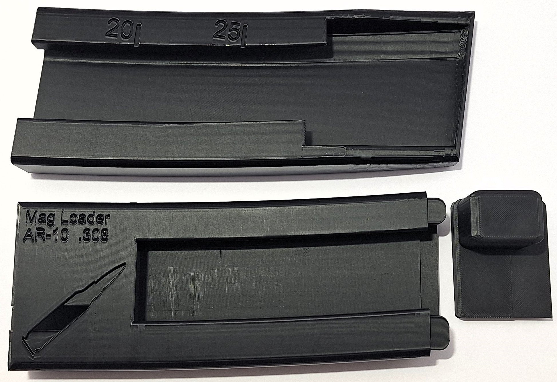 AR .308 Mag Loader with universal fit for AR-10 platforms, showcasing two magazine-sized pieces and a push block for easy travel.