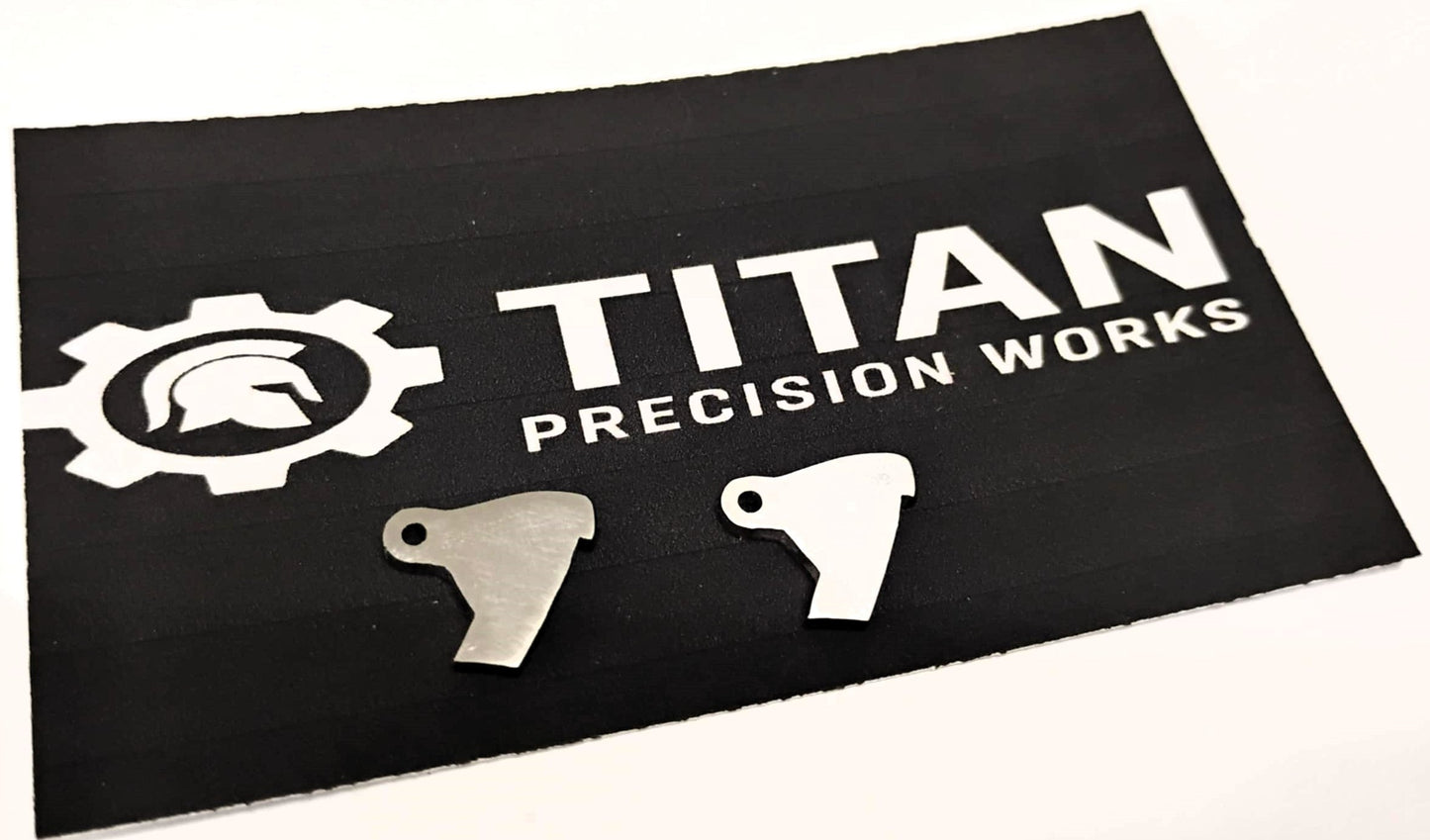 Taurus TX22 ARD trigger disconnectors 2 pack made from 304 steel with corrosion-resistant finish on Titan Precision Works mat