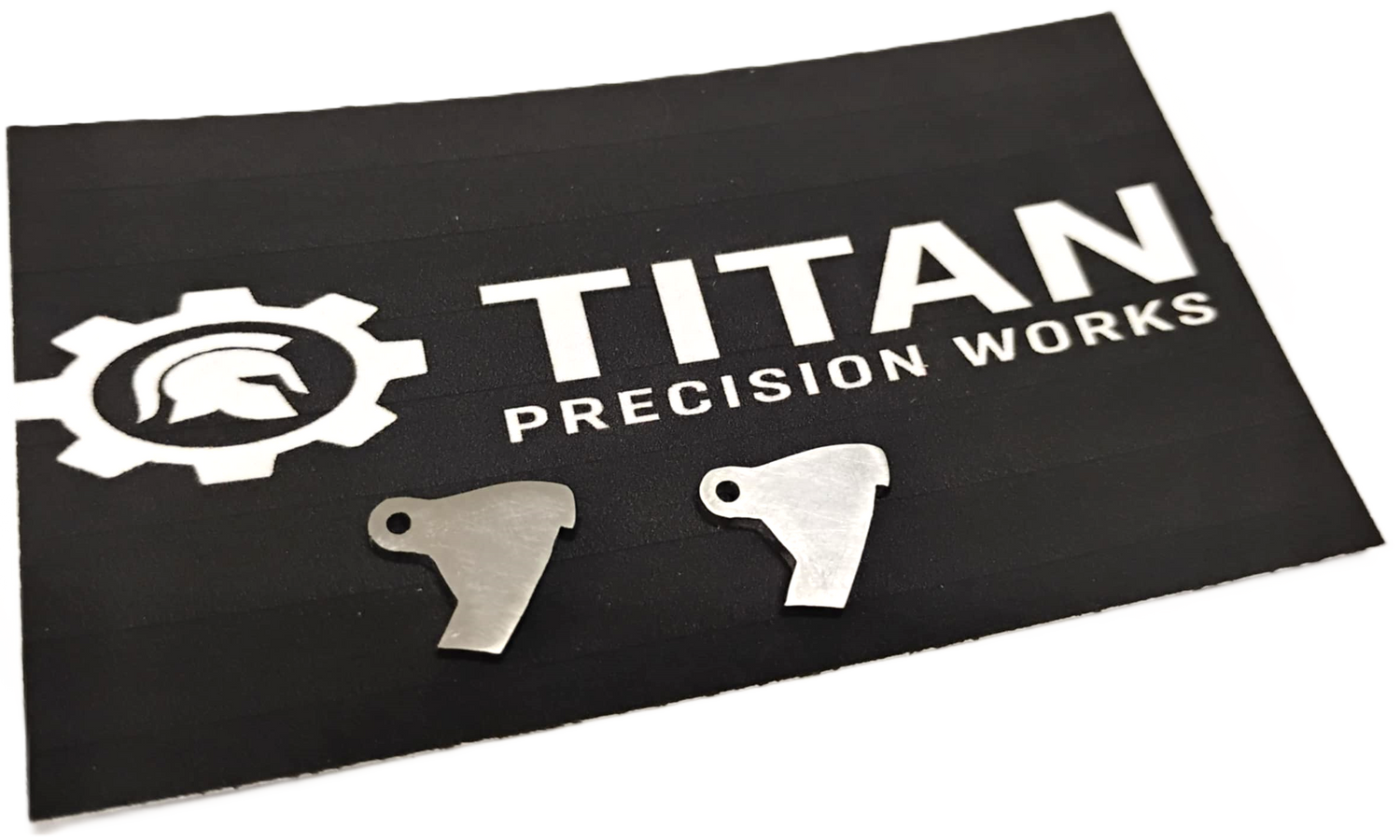 Taurus TX22 ARD trigger disconnector 2 pack made from 304 steel with corrosion-resistant finish on Titan Precision Works mat