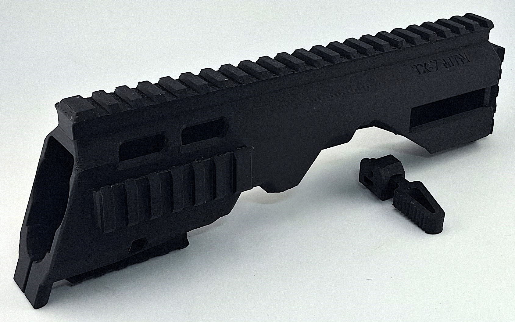 Black modular TX7-MTN chassis and MTN charging handle for TX22 firearm upgrade